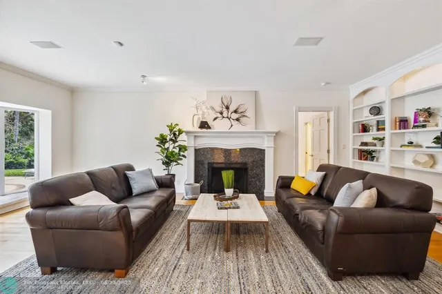 a large bathroom with a tub a sink and a large window