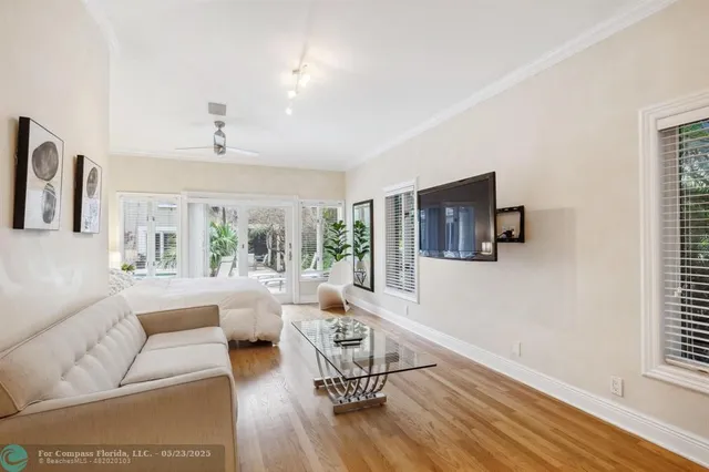 an aerial view of a house with swimming pool and porch
