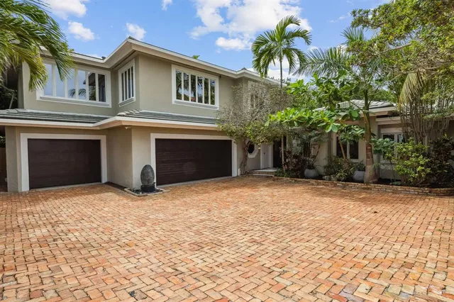 a view of a hallway view with wooden floor and staircase