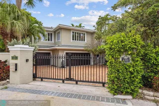 a living room with stainless steel appliances kitchen island granite countertop a large kitchen counter top and stainless steel appliances