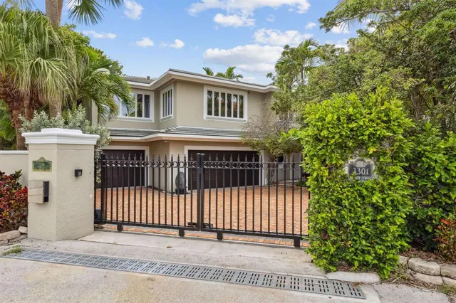 a kitchen with stainless steel appliances kitchen island granite countertop a refrigerator and a stove top oven