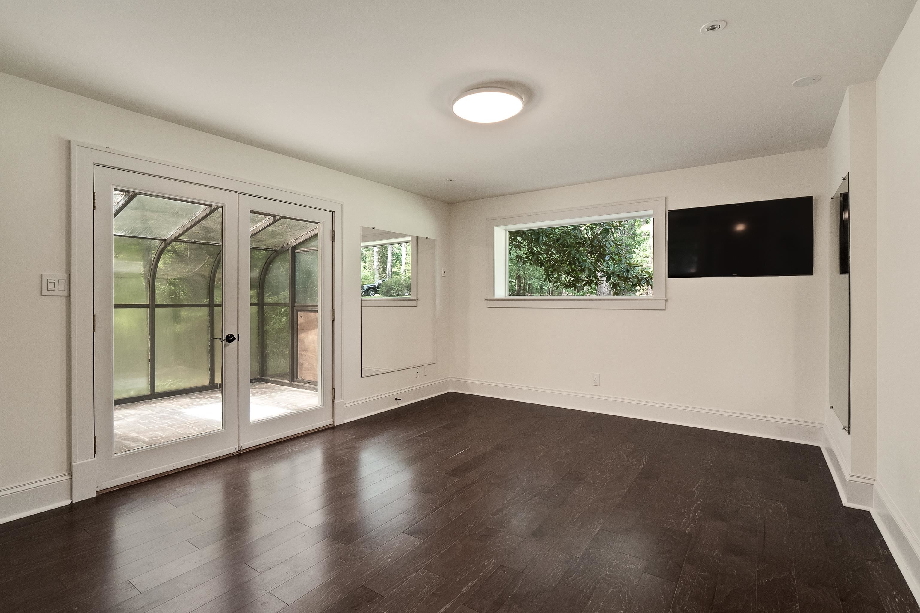 11046 Raleigh Lagrange Road East Eads, TN 38028 - Photo 27 of 40 Empty room with dark hardwood / wood-style flooring and french doors