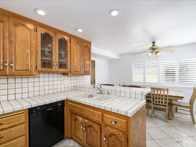a kitchen that has a sink and a stove in it
