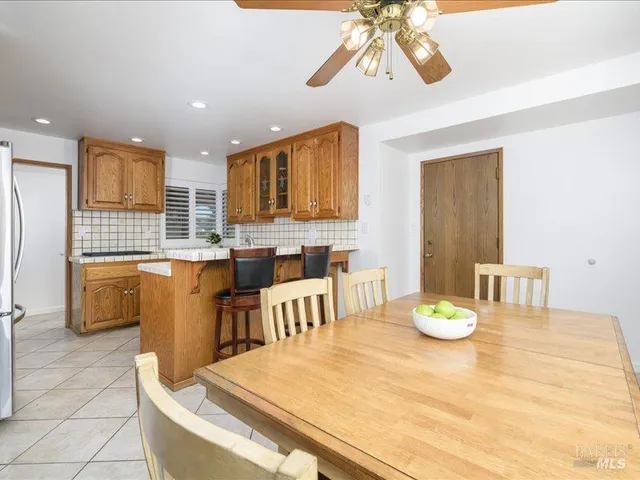 a kitchen with a table and chairs in it