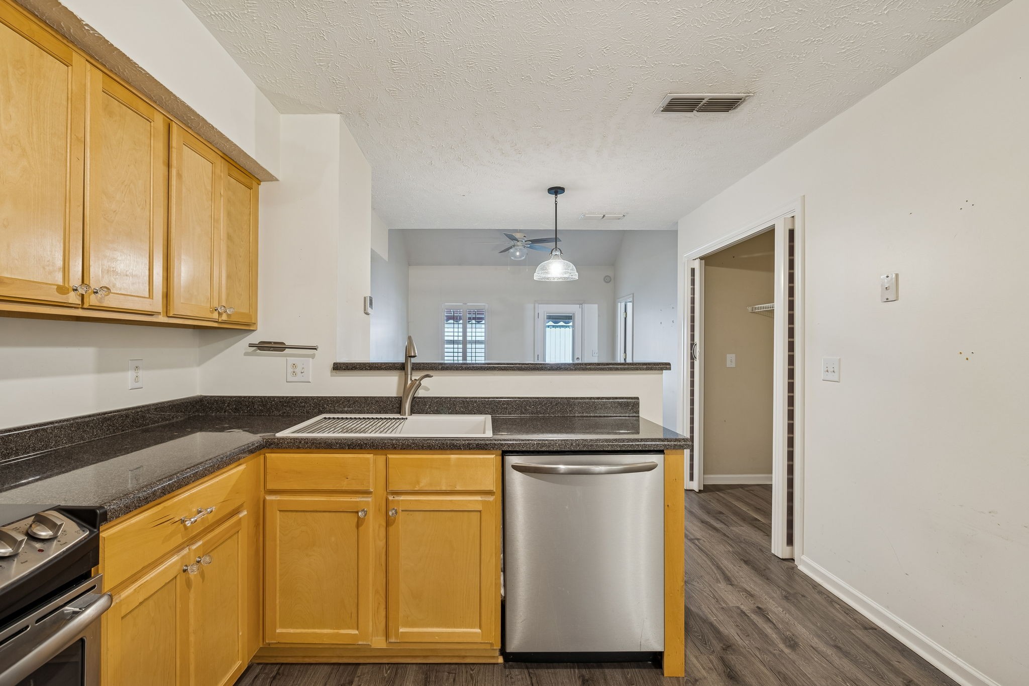 4869 Chelanie Circle Murfreesboro, TN 37129 - Photo 16 of 35 a kitchen with a sink a stove cabinets and counter space