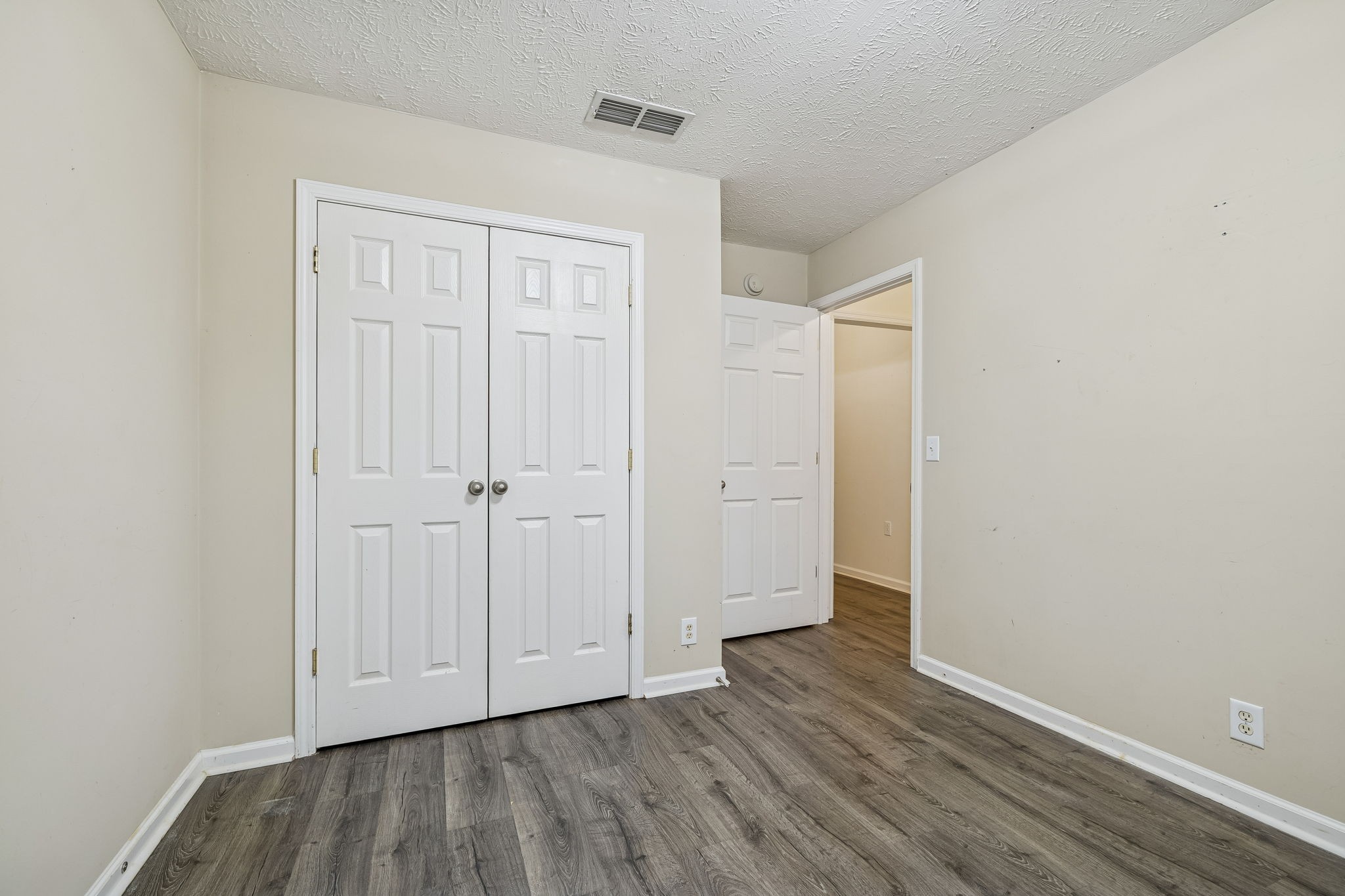 4869 Chelanie Circle Murfreesboro, TN 37129 - Photo 24 of 35 a view of an empty room with wooden floor