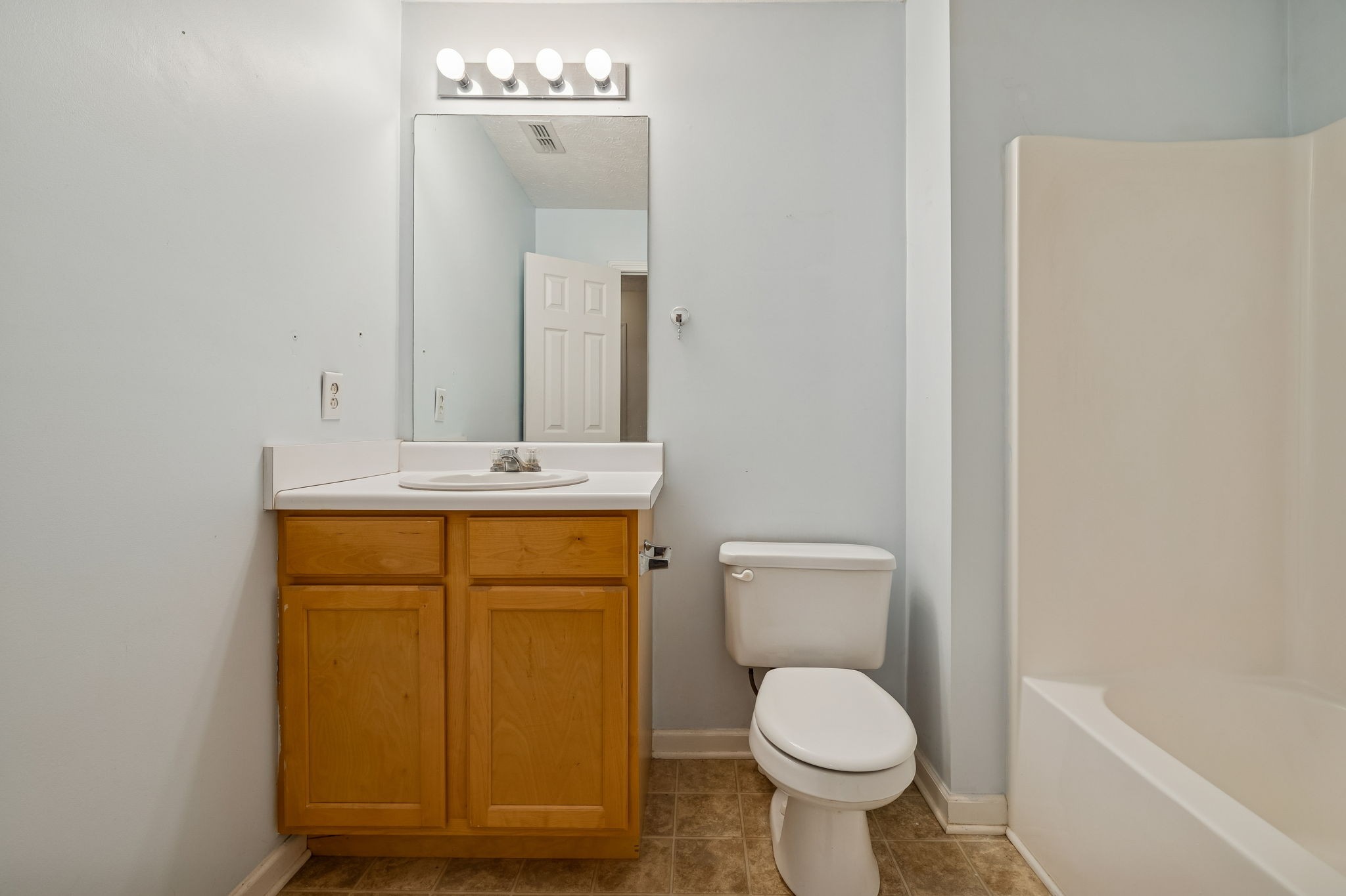 4869 Chelanie Circle Murfreesboro, TN 37129 - Photo 28 of 35 a bathroom with a sink a toilet and mirror