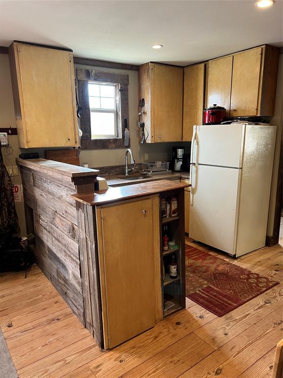 1921 Salt Creek Road Jacksboro, TX 76458 - Photo 11 of 31 a kitchen with a sink a stove a refrigerator and a sink