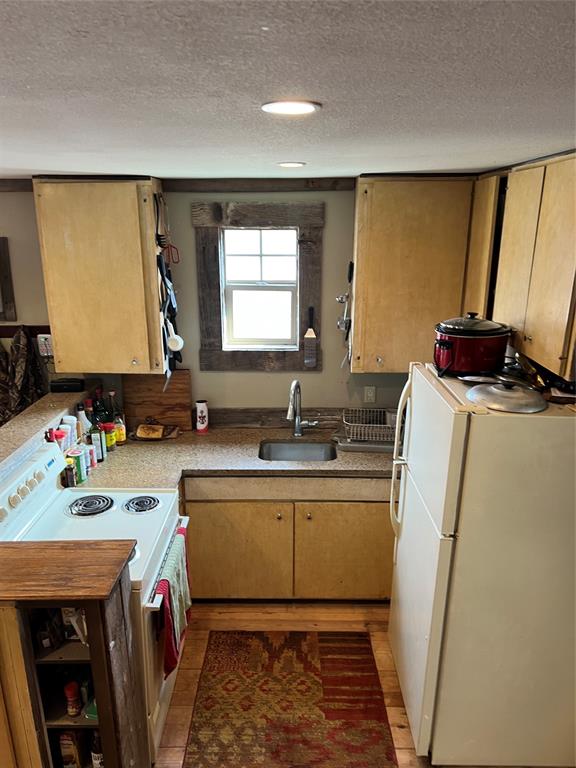 1921 Salt Creek Road Jacksboro, TX 76458 - Photo 13 of 31 a view of a kitchen with a sink and dishwasher