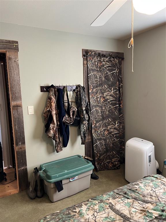 1921 Salt Creek Road Jacksboro, TX 76458 - Photo 18 of 31 a bathroom with a toilet sink and shower curtain