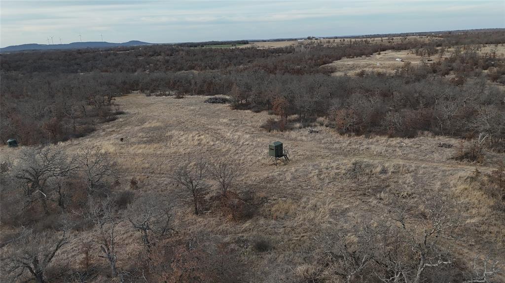 1921 Salt Creek Road Jacksboro, TX 76458 - Photo 25 of 31 a view of a dry field with mountains in the background