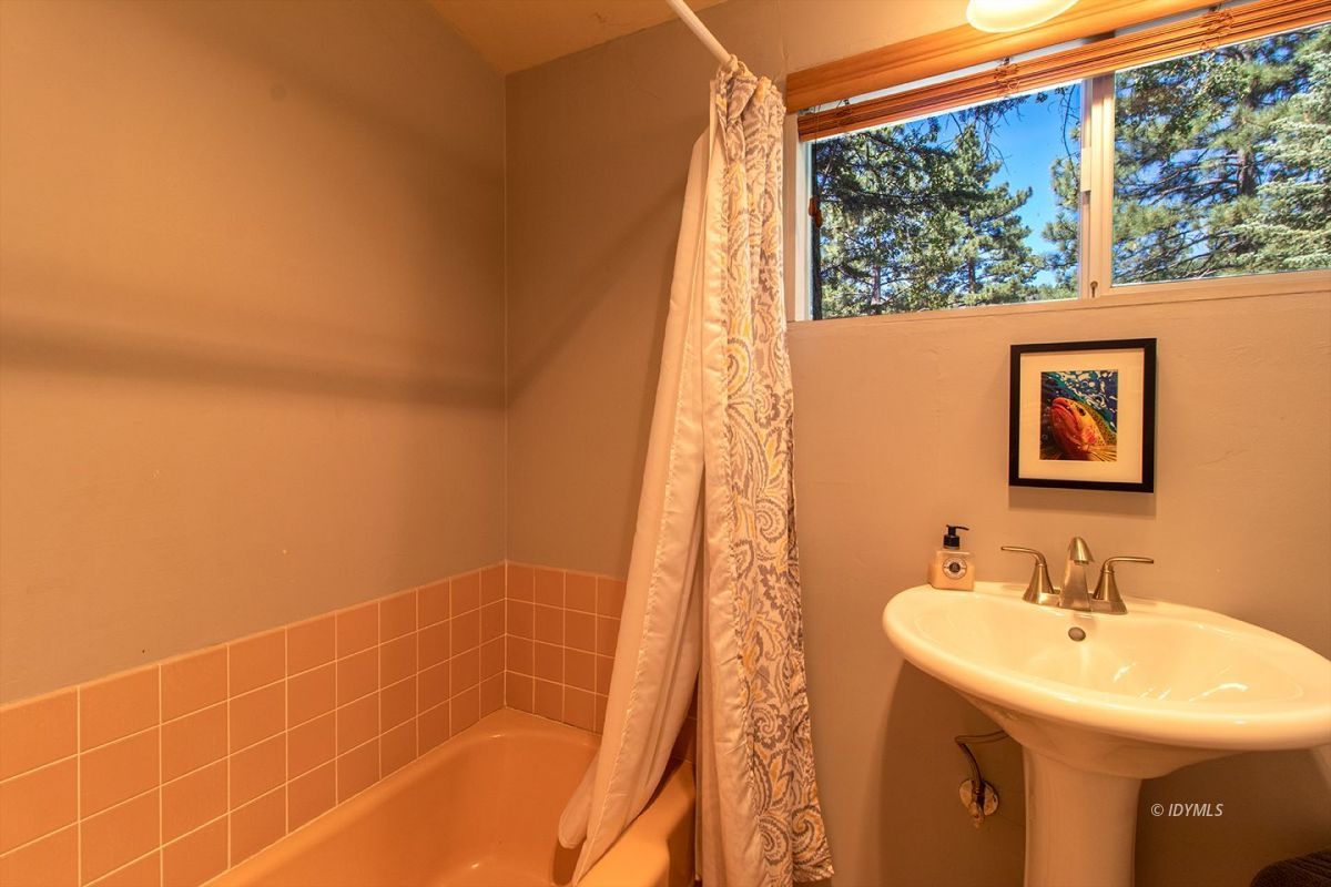 24860 Fern Valley Road Idyllwild, CA 92549 - Photo 47 of 90 a bathroom with a sink and a mirror