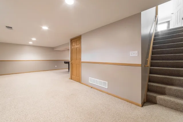 a view of an empty room with stairs
