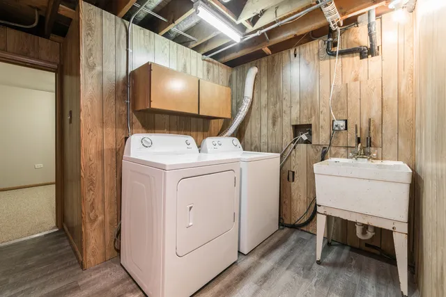 a front view of a house with a yard table and chairs