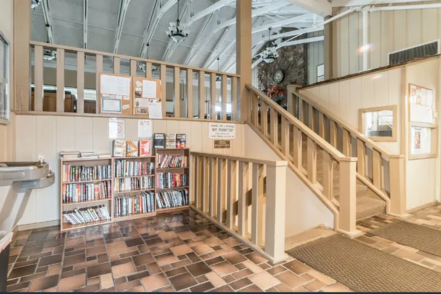 a view of an empty room with windows