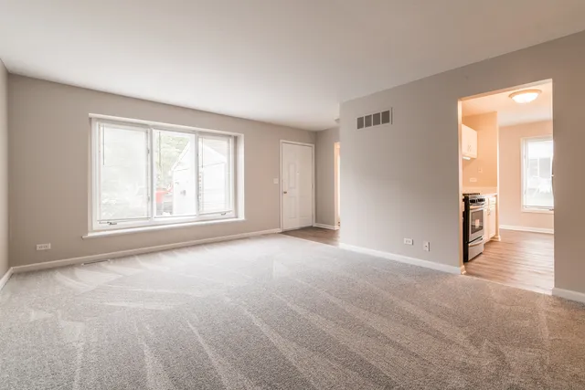 a view of an empty room with a window