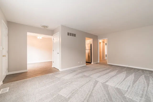 a view of an empty room and window