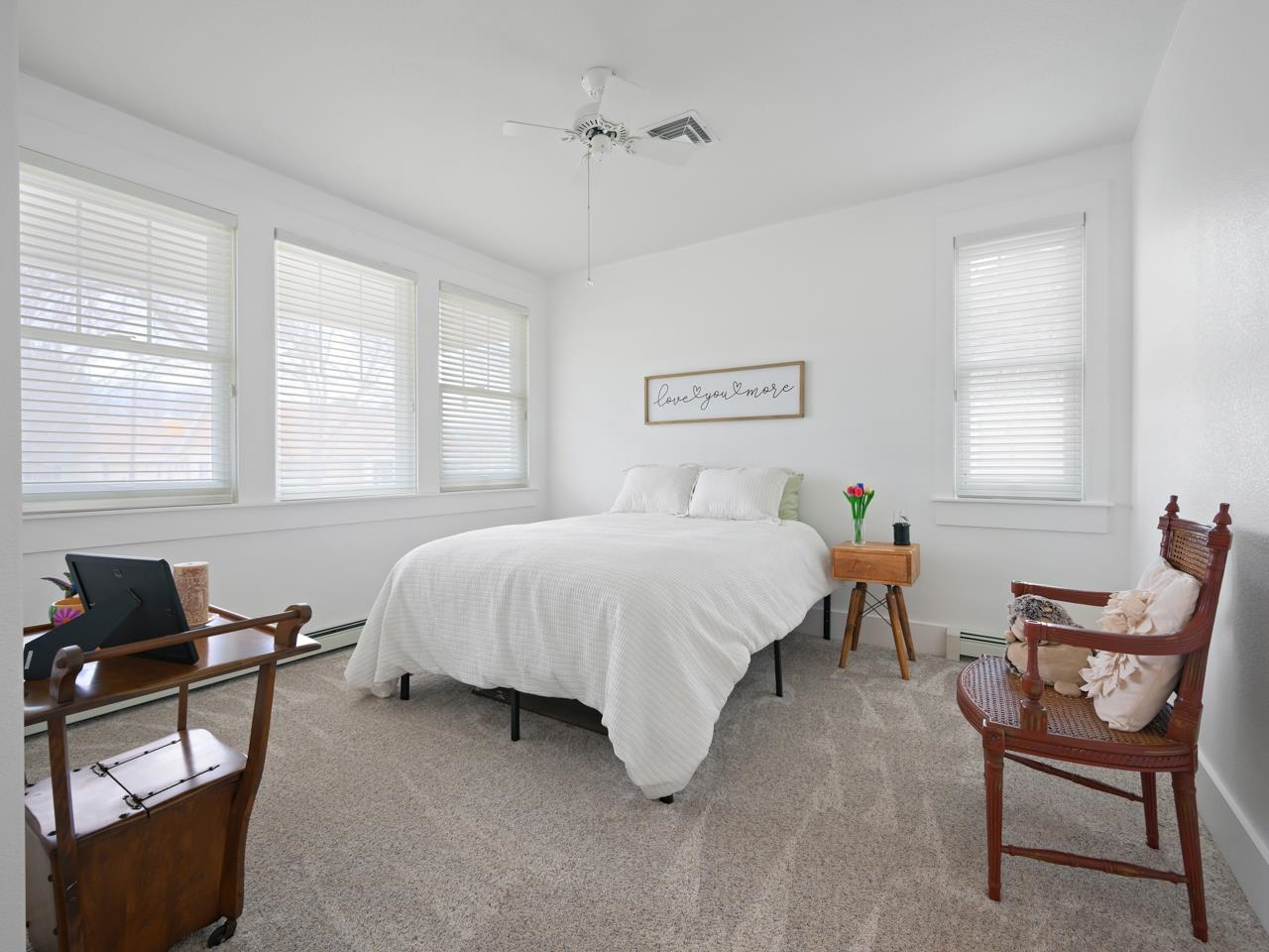 1117 Buttercup Lane Fruita, CO 81521 - Photo 20 of 25 a spacious bedroom with a bed and a window