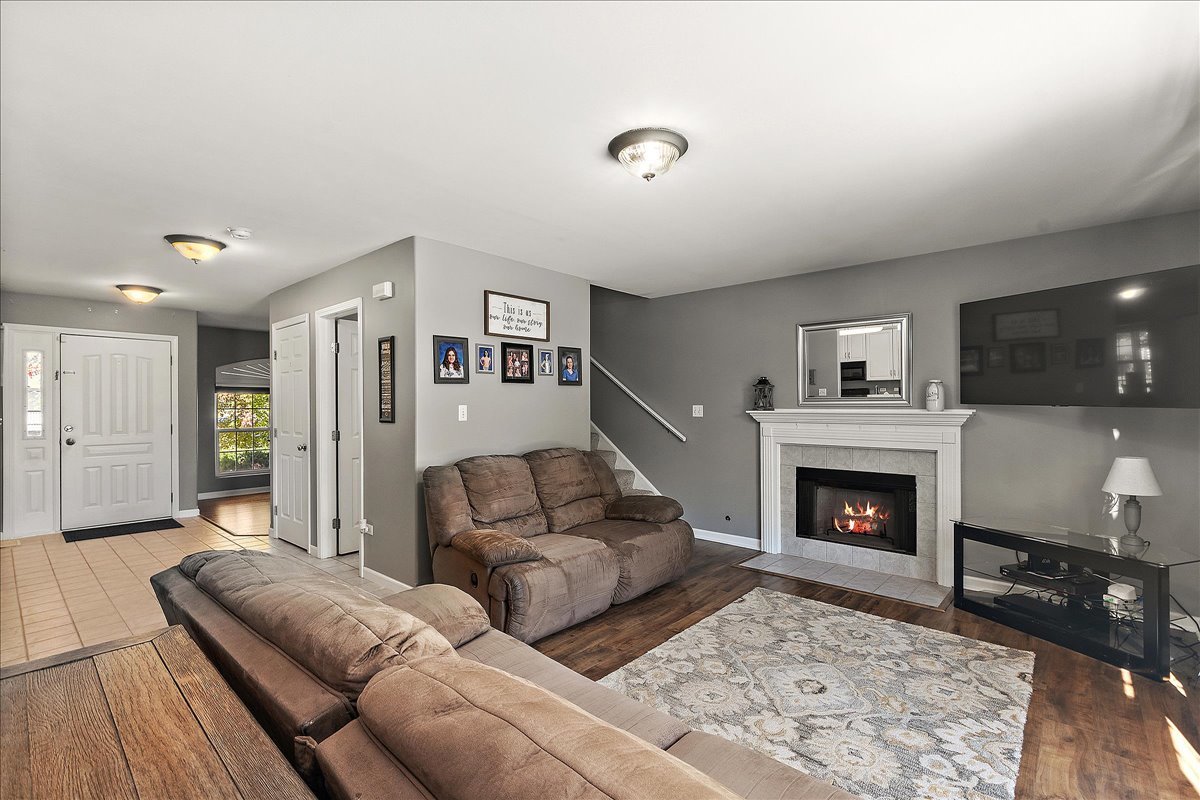 898 Meadowbrook Road Elwood, IL 60421 - Photo 11 of 30 a living room with furniture and a fireplace