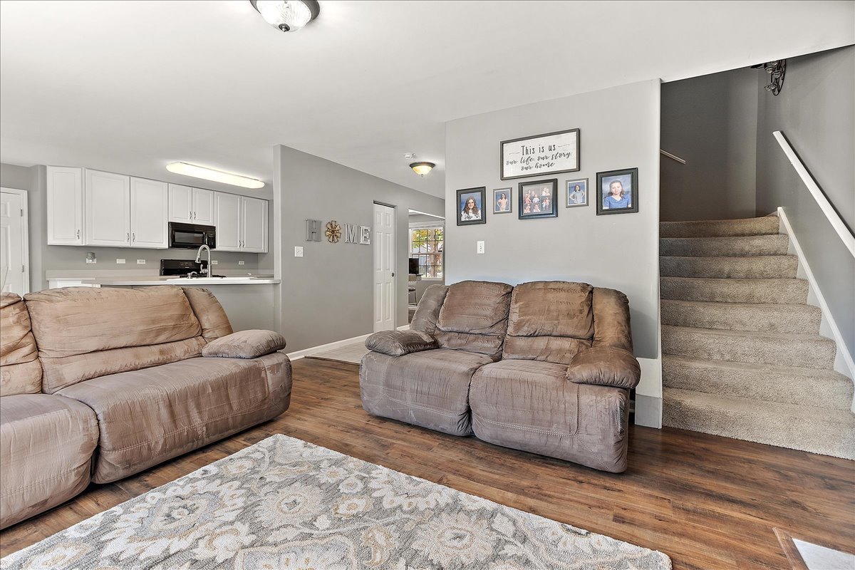 898 Meadowbrook Road Elwood, IL 60421 - Photo 13 of 30 a living room with furniture and a wooden floor