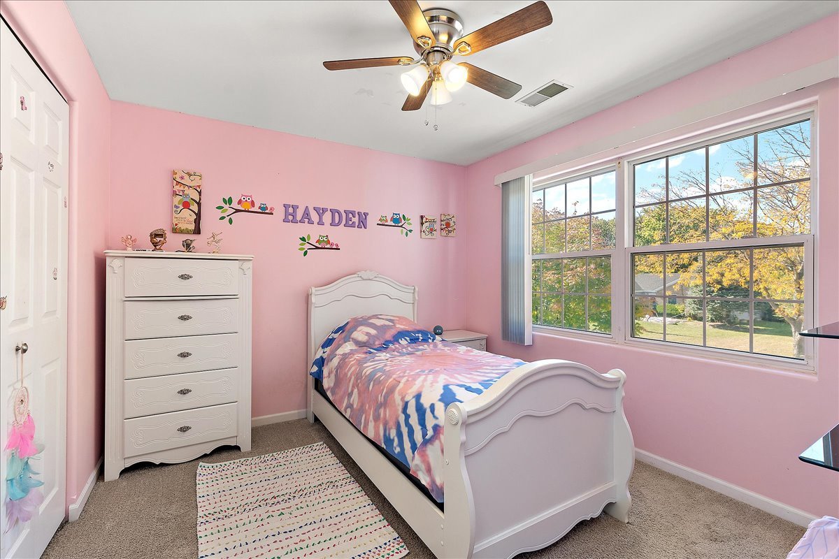 898 Meadowbrook Road Elwood, IL 60421 - Photo 21 of 30 a bed room with a bed and a window