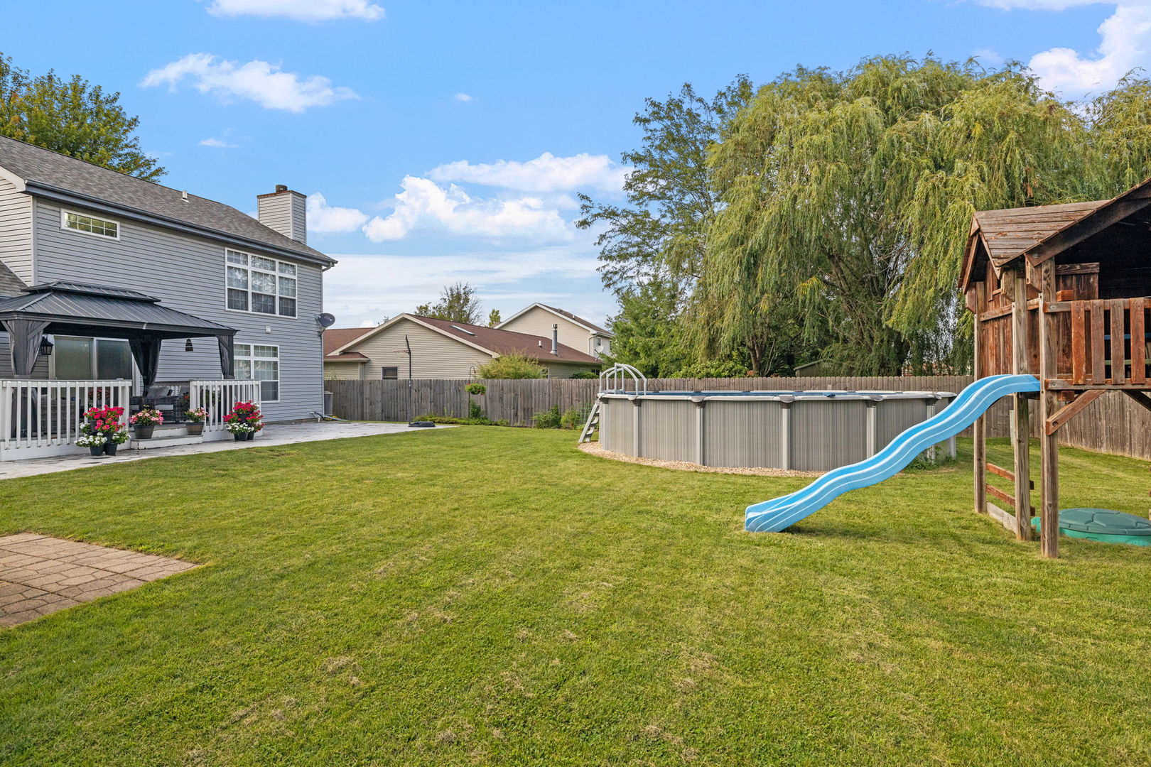 898 Meadowbrook Road Elwood, IL 60421 - Photo 27 of 30 a view of a house with a yard