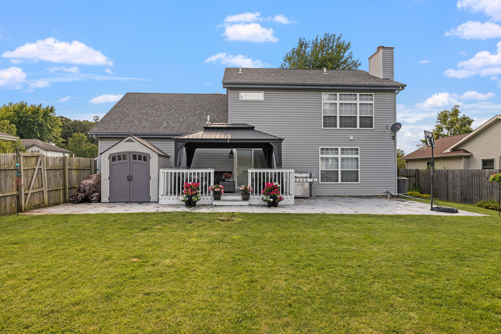 898 Meadowbrook Road Elwood, IL 60421 - Photo 30 of 30 a view of a house with a swimming pool and a yard