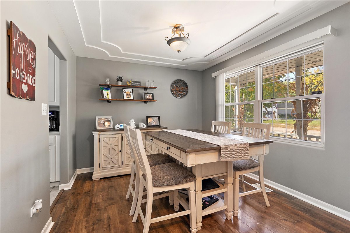 898 Meadowbrook Road Elwood, IL 60421 - Photo 8 of 30 a dining room with a wooden table and chairs