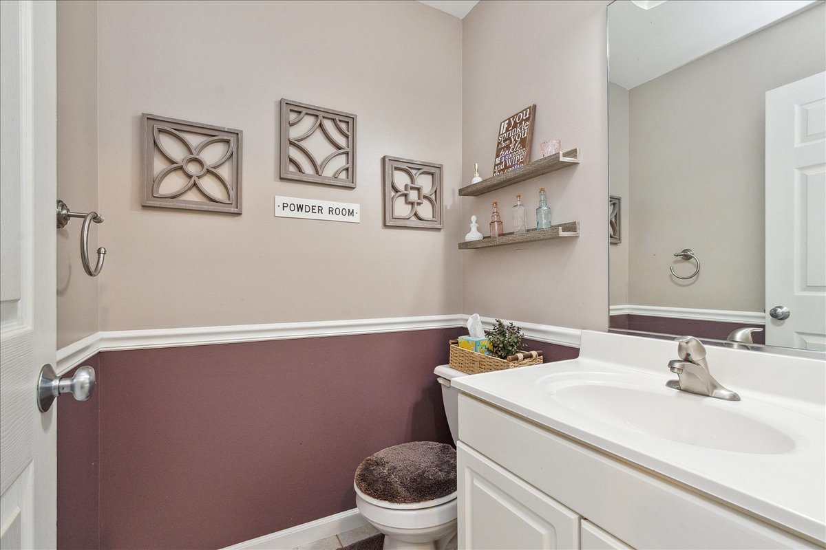 898 Meadowbrook Road Elwood, IL 60421 - Photo 9 of 30 a bathroom with a sink mirror and toilet
