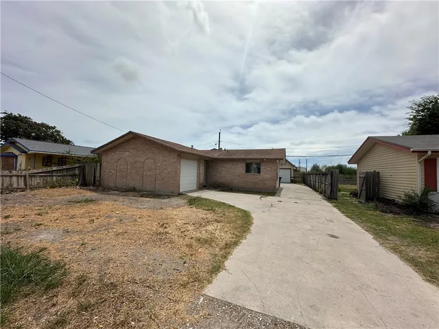 a house with yard in front of it
