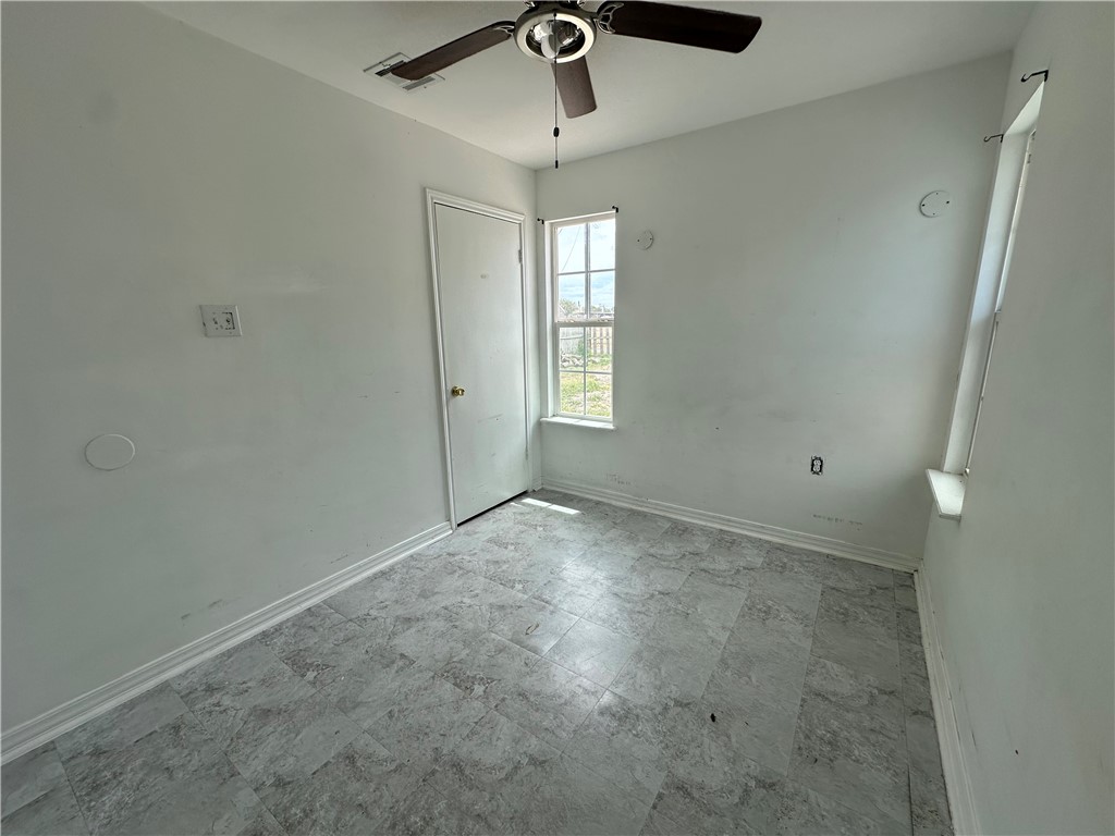 113 Lee Avenue Gregory, TX 78374 - Photo 18 of 22 a view of empty room with windows