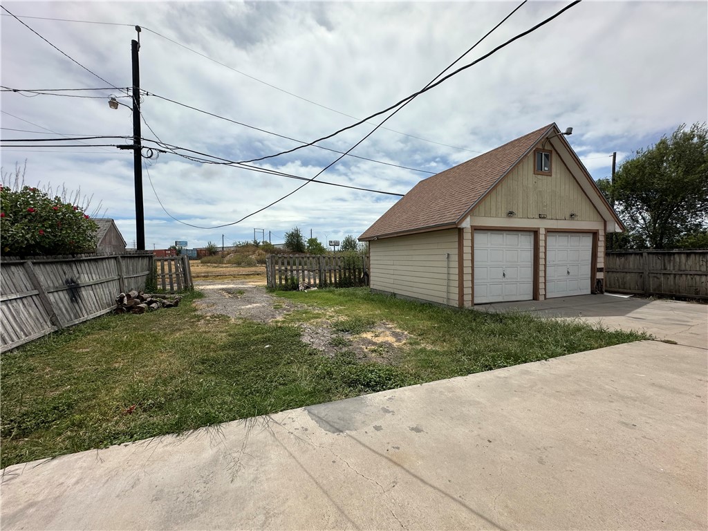 113 Lee Avenue Gregory, TX 78374 - Photo 20 of 22 a front view of house with a garden