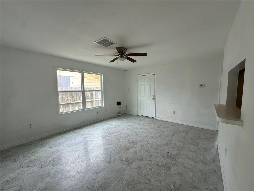 113 Lee Avenue Gregory, TX 78374 - Photo 5 of 22 a view of an empty room with a window
