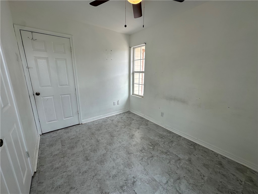 113 Lee Avenue Gregory, TX 78374 - Photo 7 of 22 an empty room with windows