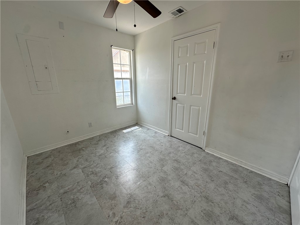 113 Lee Avenue Gregory, TX 78374 - Photo 9 of 22 an empty room with windows and closet