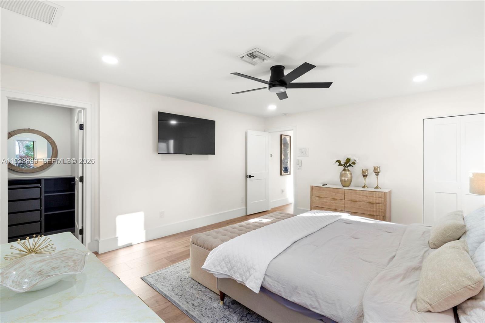 3540 Northeast 28th Avenue Lighthouse Point, FL 33064 - Photo 25 of 47 a bedroom with a bed and a flat screen tv