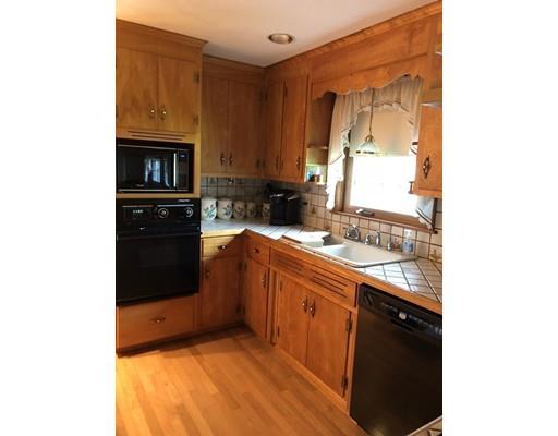 108 Woodland Road Springfield, MA 01129 - Photo 2 of 12 a kitchen with stainless steel appliances granite countertop a sink and a stove