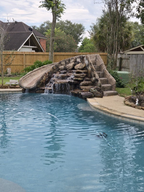 3502 Brymoor Court Pearland, TX 77584 - Photo 25 of 32 Relax near the pool with the sound of a waterfall
