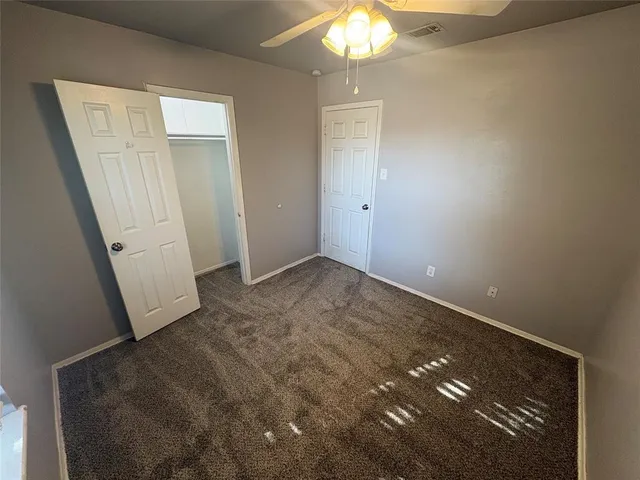 wooden floor in an empty room with a mirror