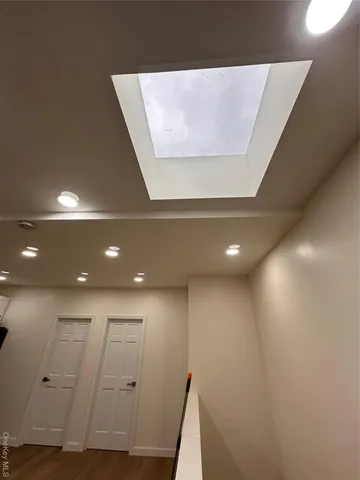 a view of kitchen with refrigerator stove microwave and cabinets