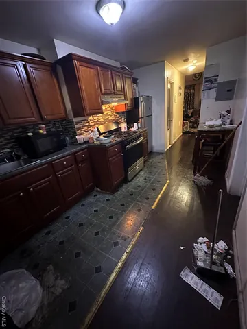 a bedroom with furniture and a flat screen tv