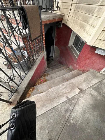 a kitchen with stainless steel appliances a sink a stove a microwave a refrigerator and cabinets