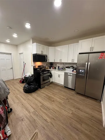 a bed room with furniture and a flat screen tv