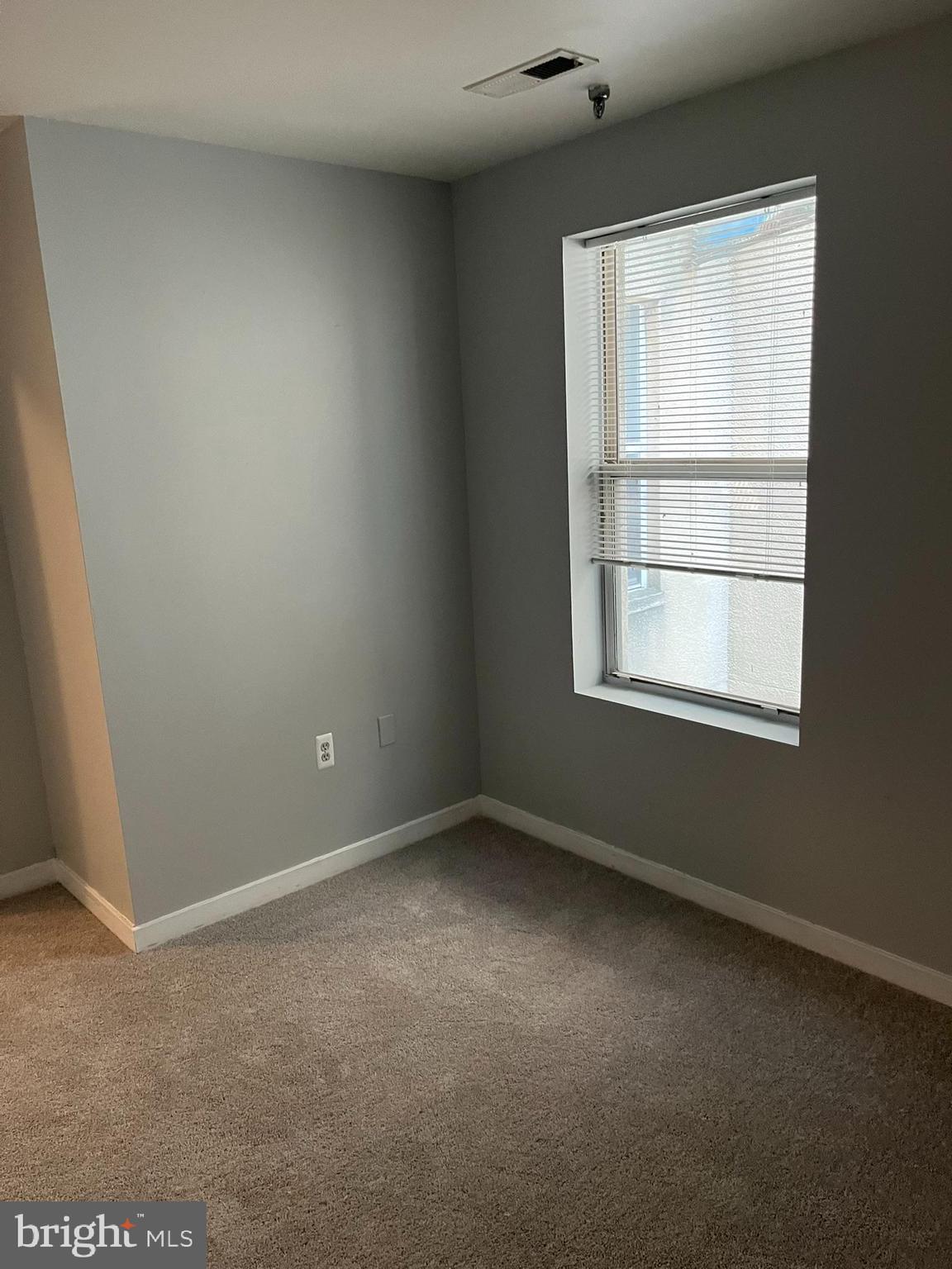 1317 West Fayette Street, Unit 3B Baltimore, MD 21223 - Photo 14 of 32 an empty room with a window