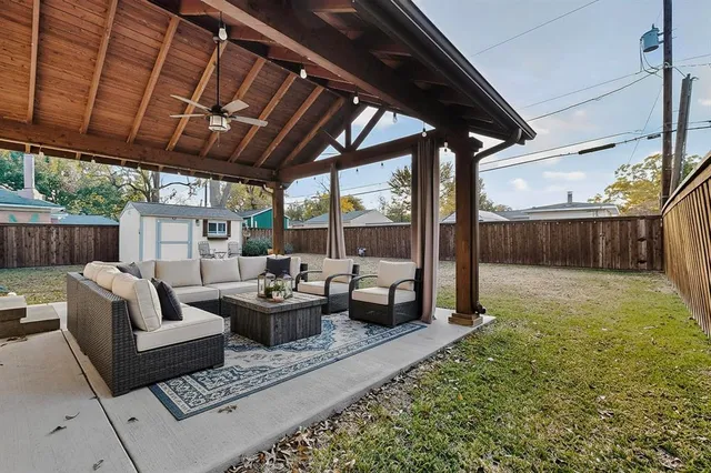 a outdoor living space with furniture and a backyard
