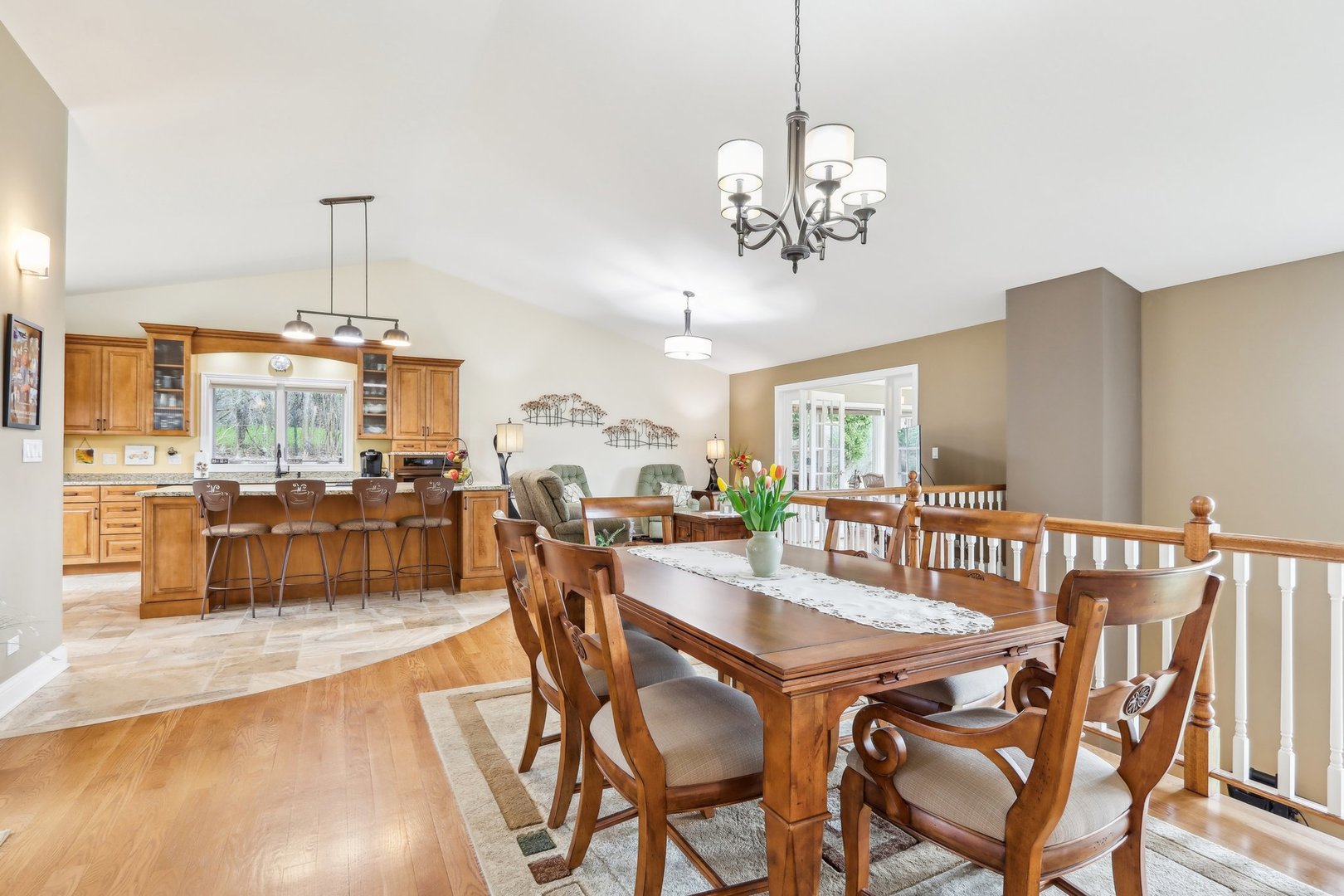 34550 Stanley Road Ingleside, IL 60041 - Photo 12 of 45 a dining area with a table chairs and a kitchen view