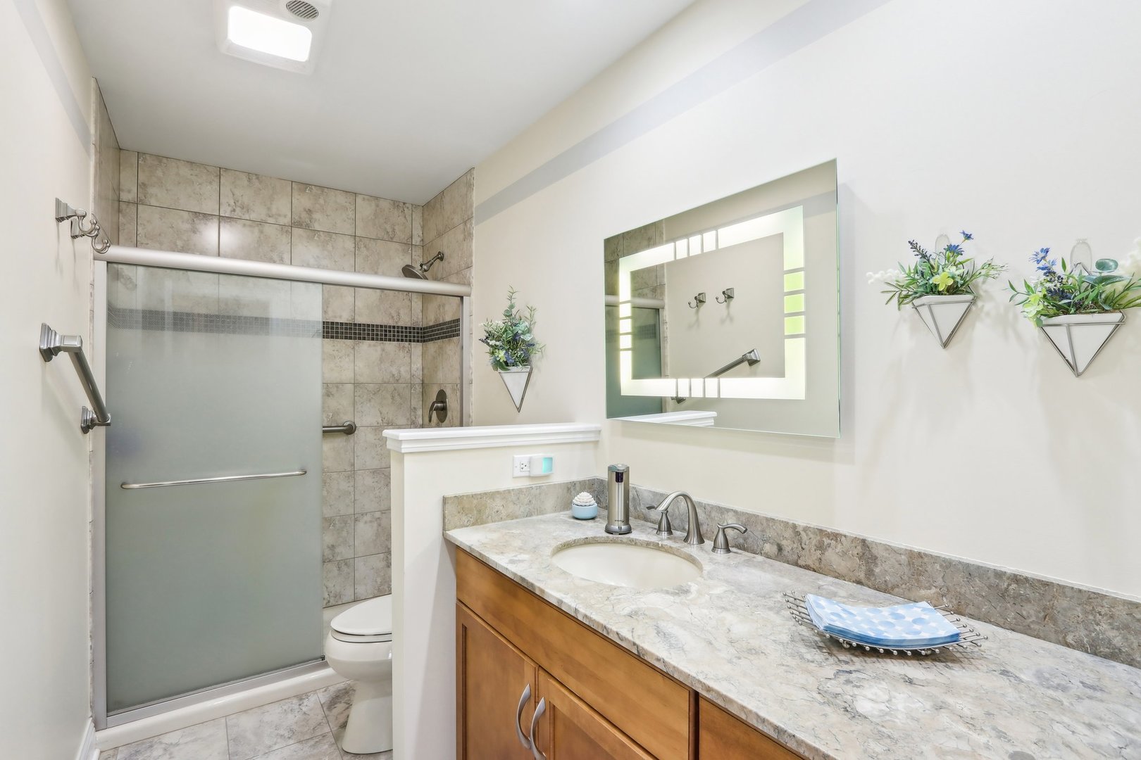 34550 Stanley Road Ingleside, IL 60041 - Photo 23 of 45 a bathroom with a granite countertop sink toilet and shower