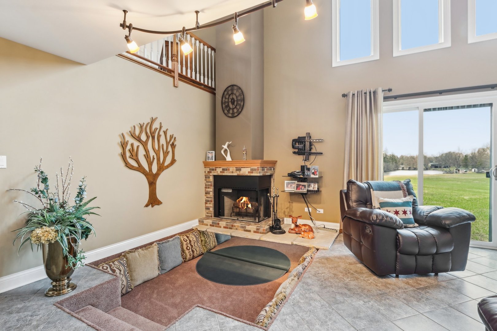 34550 Stanley Road Ingleside, IL 60041 - Photo 26 of 45 a living room with furniture potted plant and a fireplace