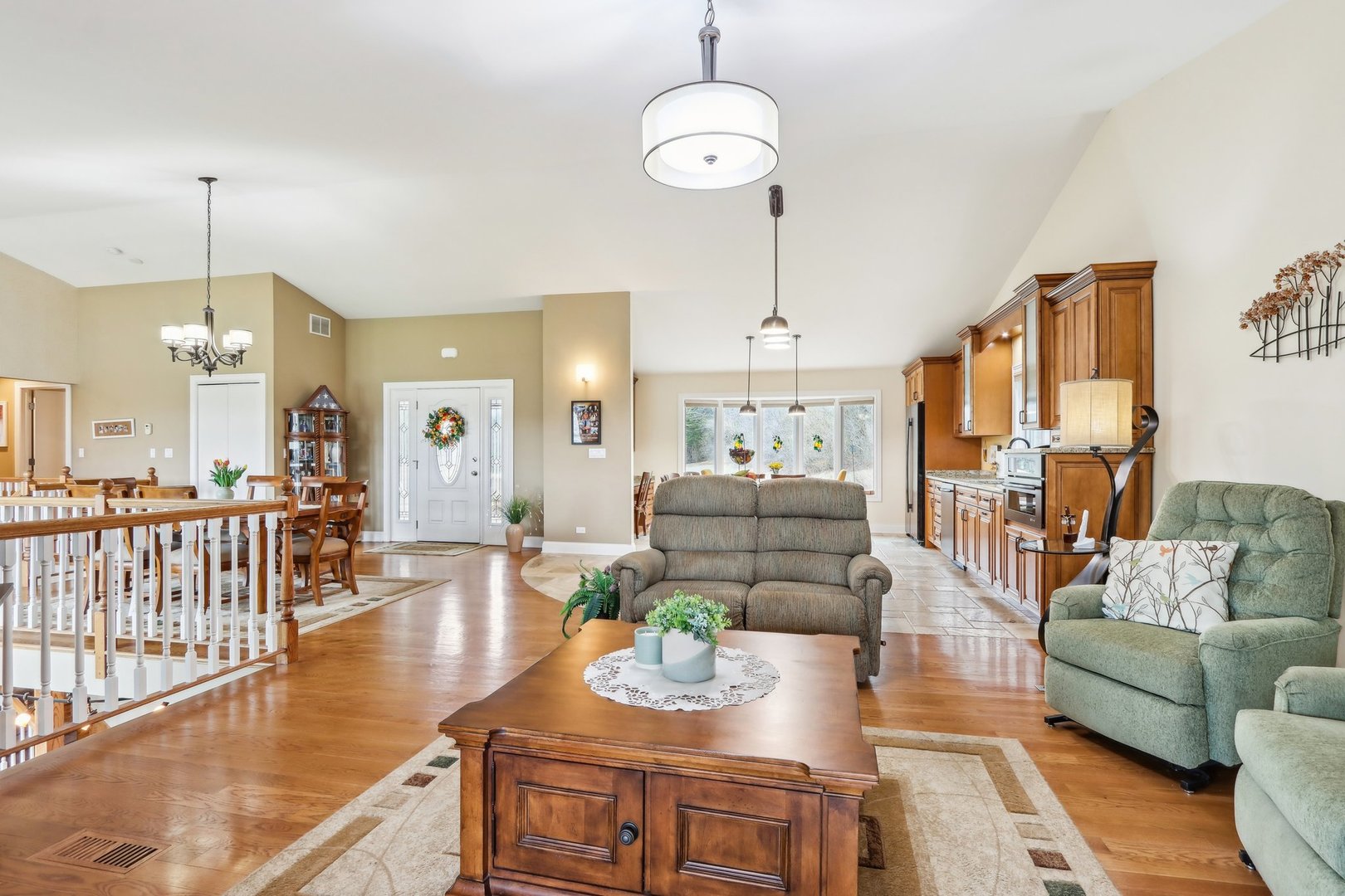 34550 Stanley Road Ingleside, IL 60041 - Photo 4 of 45 a living room with furniture dining table wooden floor and a chandelier