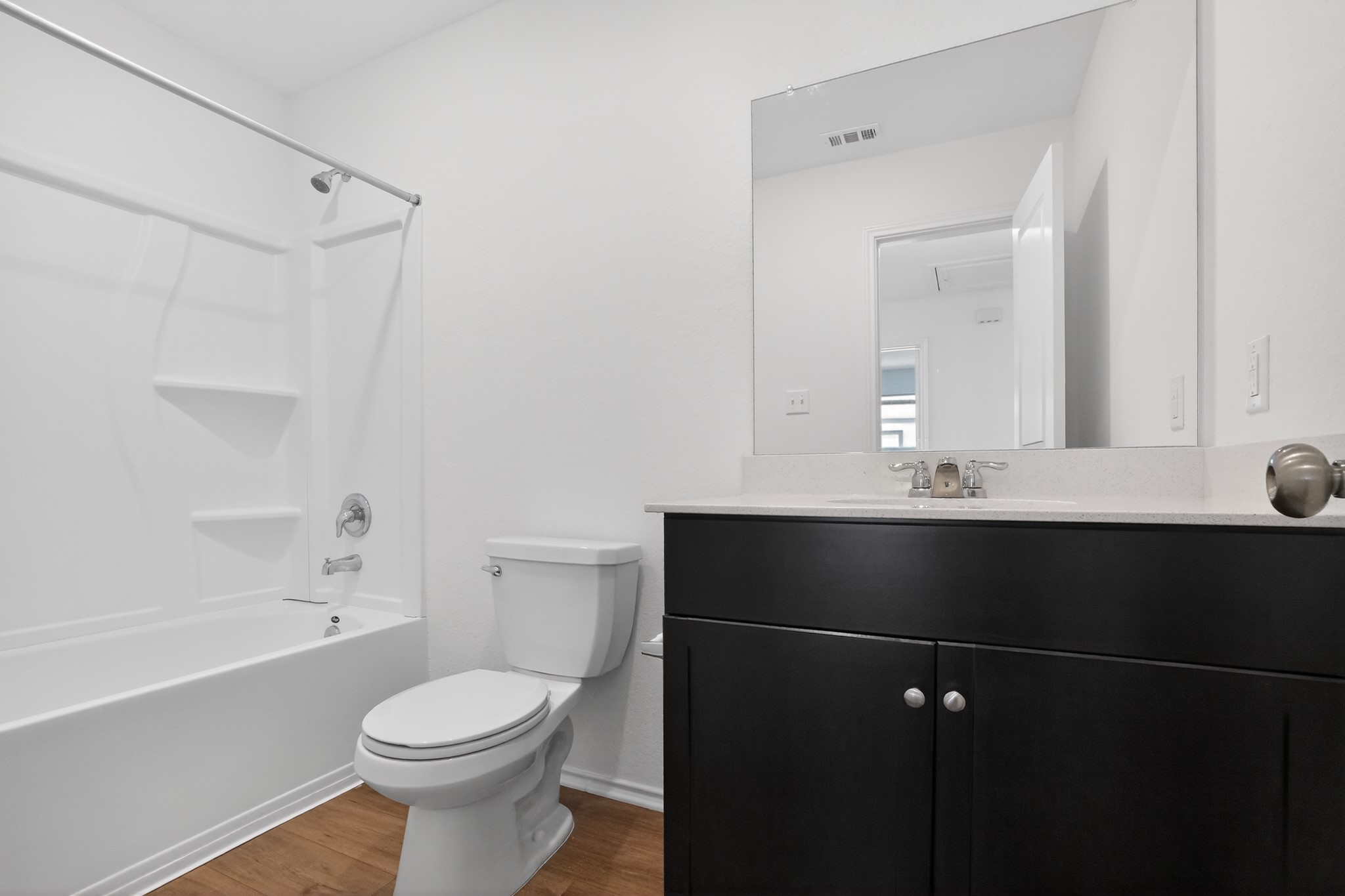 604 Marty Allen Loop Jarrell, TX 76537 - Photo 13 of 15 A well-appointed bath features a sleek vanity and convenient tub-shower combination.